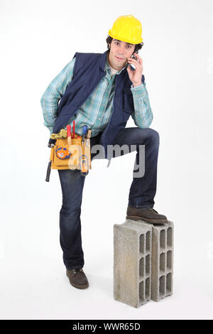 Construction worker using a cellphone Stock Photo
