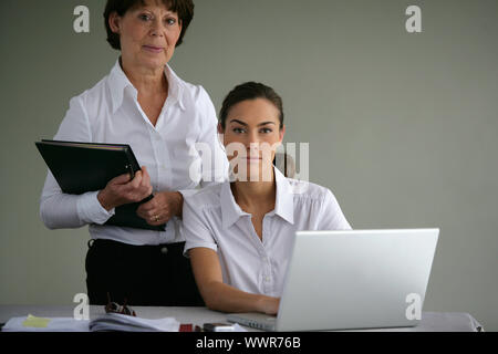 Young and senior businesswomen Stock Photo