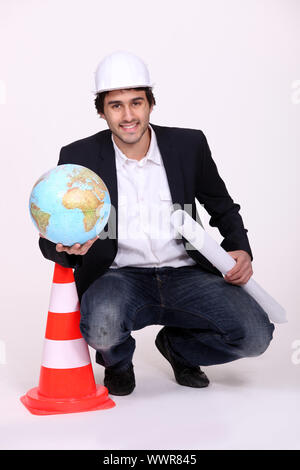 Architect holding a globe Stock Photo