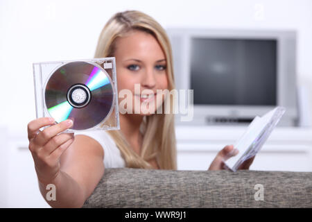 Girl listening to CDs Stock Photo