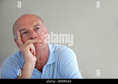 A thoughtful elderly man Stock Photo