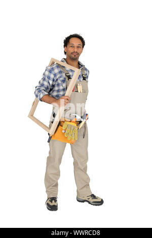 carpenter holding a window frame Stock Photo