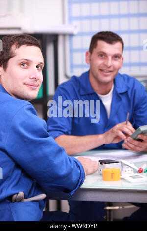 Industrial workers discussing Stock Photo