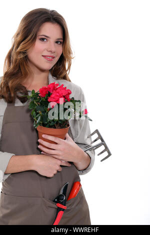 gardener carrying plant, tool Stock Photo