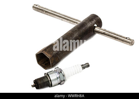 Old wrench key and spark plug, isolated on white, with clipping path Stock Photo