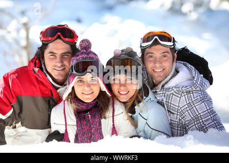 Two couples in a ski slope Stock Photo