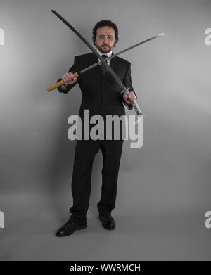 Young businessman in defensive pose afraid of something isolated on ...
