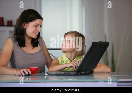 Mother and daughter using a  laptop Stock Photo