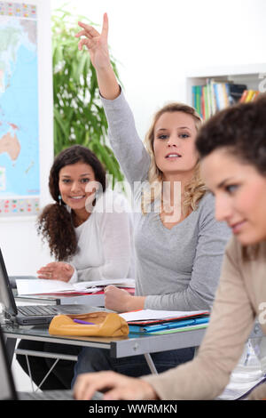 Student asking question in class Stock Photo