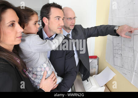 couple and child in architect's office Stock Photo