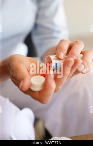 Woman with medication Stock Photo