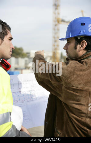 Workers on a construction site Stock Photo