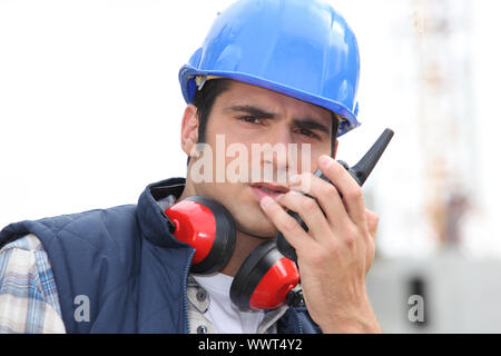 craftsman using a talkie-walkie Stock Photo