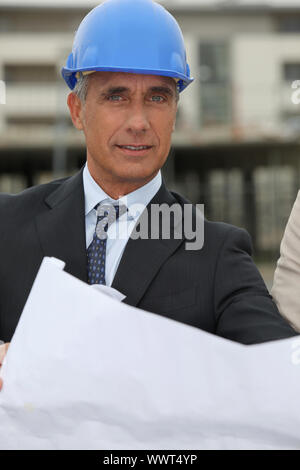 Senior architect working on-site Stock Photo