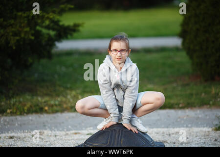 Stylish smiling male sitting in the park - a Royalty Free Stock Photo from  Photocase