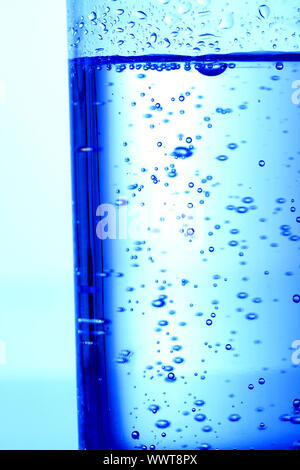 blue bubbled water in glass Stock Photo