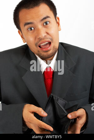 Man In A Suit Showing His Wallet Is Empty Stock Photo