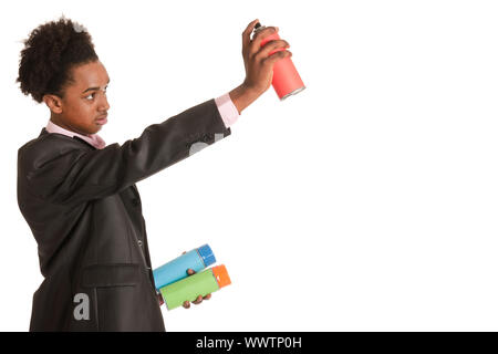 Studio portrait of a young African American man with graffiti aerosols Stock Photo