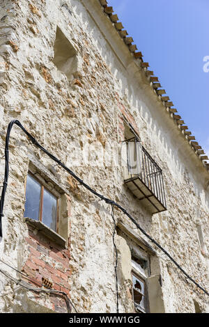 Old iron window with wooden edges on a Spanish street. Traditional architecture in spain Stock Photo