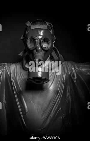 Ebola infection concept, man with red gas mask Stock Photo