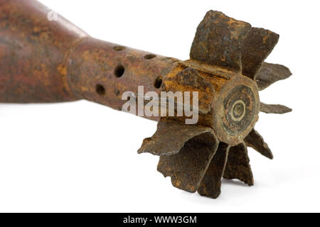 Old rusted World War II mortar shell isolated, selective focus