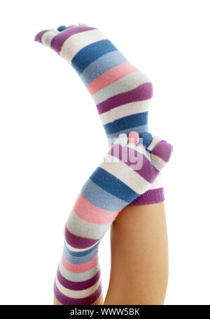 beautiful legs in funny socks over white Stock Photo