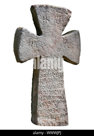 The ancient medieval Slavic stone cross isolated on white background Stock Photo