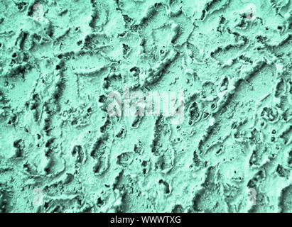 Old cracked neo mint mettalic background. Cracked paint on an old metallic surface. Trendy color backgound. Stock Photo