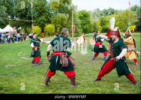 Live show by a Slovak group of performers depicting Turkish medieval soldiers in action. Historical festival at the Pultusk castle in central Poland, Stock Photo