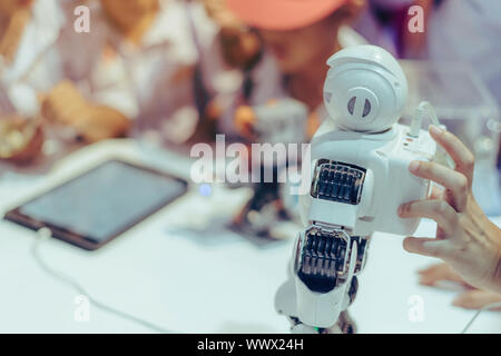 Students are testing robot control in an elementary school laboratory. Stock Photo