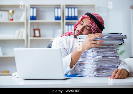 Arab businessman working in the office doing paperwork with a pi Stock Photo