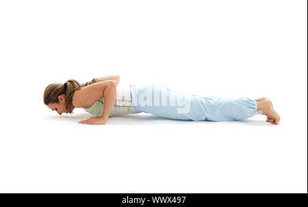 Woman yoga trainer doing a variation of Chaturanga Dandasana (four-limbed  staff) pose Stock Photo - Alamy