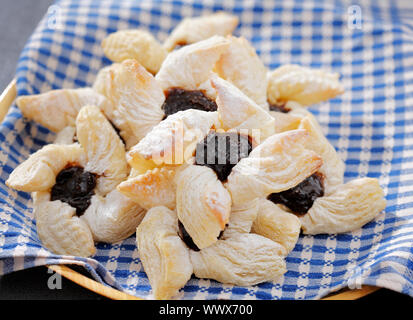 Traditional finnish 'joulutorttu' christmas puff pastries with dried plum marmalade. Stock Photo