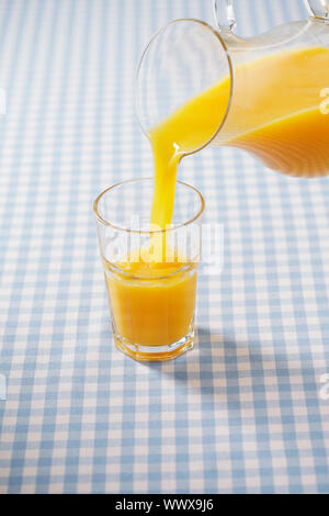 pitcher and a glass of orange juice Stock Photo - Alamy