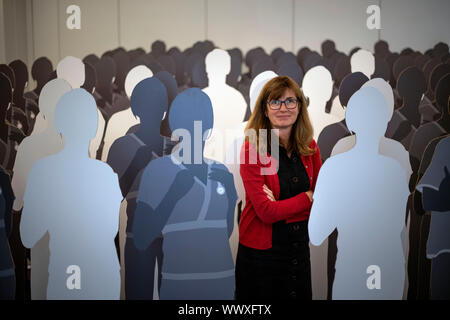 EMBARGOED TO 0001 TUESDAY SEPTEMBER 17 Nurse Patricia Marquis with 100 life-size cardboard cut-outs of nurses, with 11 blanked out to illustrate the 11% nursing vacancy rate in the NHS in England, during the launch of a safe nurse staffing in England campaign at the Royal College of Nursing in central London. Stock Photo