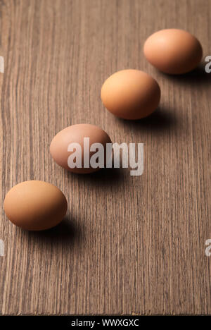 Brown eggs in a line on white background Stock Photo