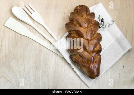 Appetizing sweet white bread on a napkin. Stock Photo