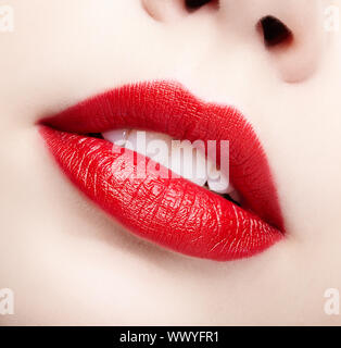 Closeup macro portrait of female part of face. Human woman lips with day beauty makeup. Girl with perfect plump lips shape Stock Photo