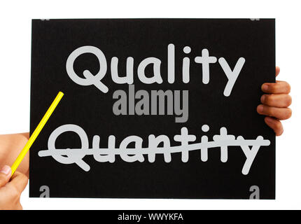 Pointing To Quality Not Quantity Words On Board Stock Photo