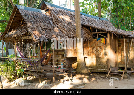 Stylish bamboo and palm thatch house at the beachside in Ko Lanta, Thailand Stock Photo