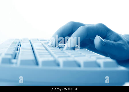girl hands typing on keyboard macro close up Stock Photo