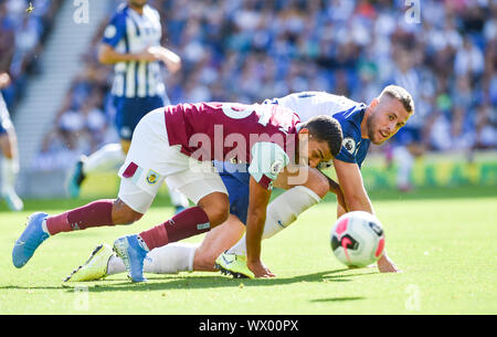 Aaron Lennon of Burnley (left) battles with Adam Webster of Brighton for the ball during the Premier League match between Brighton and Hove Albion and Burnley at the American Express Community Stadium , Brighton , 14 September 2019 - Editorial use only. No merchandising. For Football images FA and Premier League restrictions apply inc. no internet/mobile usage without FAPL license - for details contact Football Dataco Stock Photo