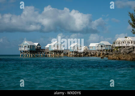 The abandoned 9 Beaches resort in Somerset Bermuda showing beach huts on stilts in the ocean Stock Photo
