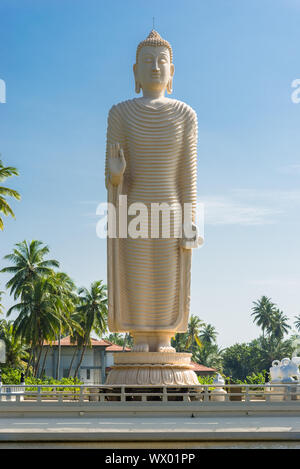 Large standing Buddha near Hikkaduwa reminds to the Tsunami disaster in 2004 Stock Photo