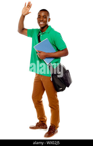 Cheerful student waving his hands. Enjoying himself. all on white background Stock Photo