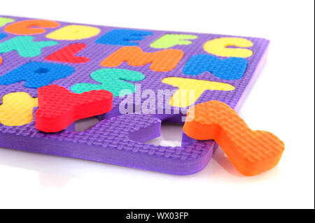 Finishing the alphabet with colorful letters in the puzzle Stock Photo