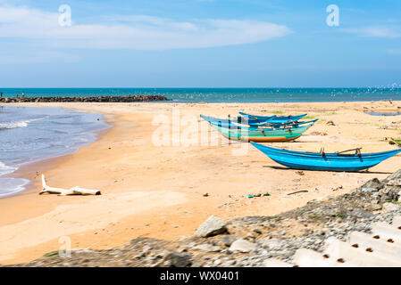 Beach with outrigger canoes on the way to Colombo, Sri Lanka Stock Photo