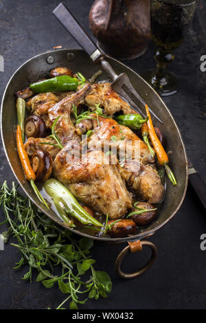 Rabbit with Vegetable and Mushrooms as top view in a Stewpot Stock Photo