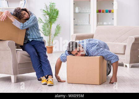 Young family moving in to new apartment after paying off mortgage Stock Photo