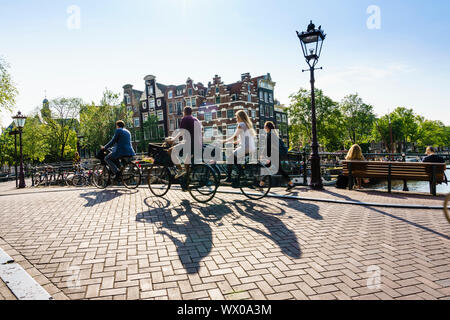 Cyclists on a bridge over Brouwersgracht, Amsterdam, North Holland, The Netherlands, Europe Stock Photo